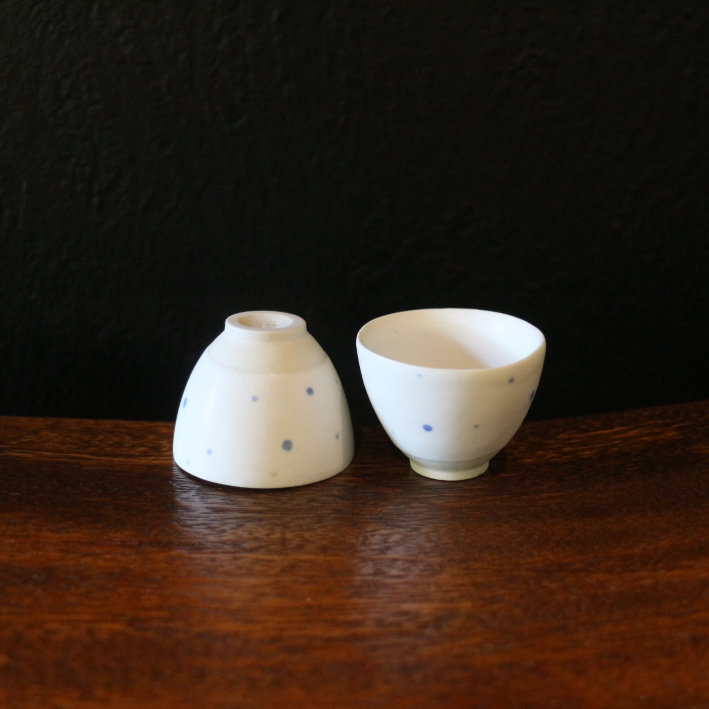 White porcelain blue polka dot tea cup